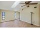 Large bedroom with high ceilings, skylight, and ceiling fan at 2397 Cannolot Blvd, Port Charlotte, FL 33948