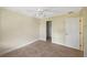 Bedroom with ceiling fan and ample closet space at 2397 Cannolot Blvd, Port Charlotte, FL 33948