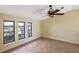 Living room with large windows and ceiling fan at 2397 Cannolot Blvd, Port Charlotte, FL 33948