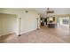 Bright and airy living room with tile flooring and ceiling fan at 2397 Cannolot Blvd, Port Charlotte, FL 33948