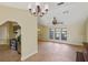 Living area with high ceilings, tile floors and kitchen view at 2397 Cannolot Blvd, Port Charlotte, FL 33948