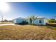 Cute light blue single Gathering home with metal roof at 409 Boundary Blvd, Rotonda West, FL 33947