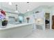 Spacious kitchen island with granite countertop and white cabinetry at 409 Boundary Blvd, Rotonda West, FL 33947