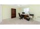 Home office with built-in shelving and a workspace at 409 Boundary Blvd, Rotonda West, FL 33947