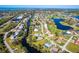 Aerial view showcasing home's waterfront location and neighborhood context at 4678 Arlington Dr, Placida, FL 33946