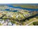 Aerial view of property with canal access and nearby community amenities at 4678 Arlington Dr, Placida, FL 33946