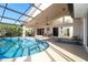 Bright and airy pool area with screened enclosure, and plenty of seating at 4678 Arlington Dr, Placida, FL 33946