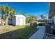 Large backyard with shed, patio, and fenced area at 537 Shamrock Blvd, Venice, FL 34293