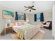 Bright bedroom with a king-size bed and wicker furniture at 537 Shamrock Blvd, Venice, FL 34293