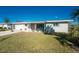 Newly painted house exterior with a vibrant coral door at 537 Shamrock Blvd, Venice, FL 34293