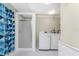 Laundry room with washer, dryer, and shower at 537 Shamrock Blvd, Venice, FL 34293