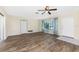 Living room featuring wood-look floors and a view to the kitchen at 537 Shamrock Blvd, Venice, FL 34293