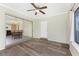 Sunroom with wood-look floors and view of the dining area at 537 Shamrock Blvd, Venice, FL 34293