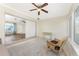 Bright sunroom with a wicker chair and view of the living room at 537 Shamrock Blvd, Venice, FL 34293