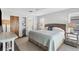 Bright bedroom with a king-size bed and ensuite bathroom at 560 Sandlor Dr, Englewood, FL 34223