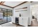 White cabinets and wine cooler with pool view at 560 Sandlor Dr, Englewood, FL 34223