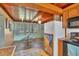 Kitchen with wood cabinets and a view into the adjacent living area at 135 W Langsner St, Englewood, FL 34223