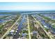 Aerial view of waterfront community with numerous houses and canals at 15625 Melport Cir, Port Charlotte, FL 33981