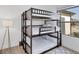 Triple bunk bed in a well-lit bedroom at 15625 Melport Cir, Port Charlotte, FL 33981