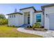 Inviting front entrance with stone walkway and landscaping at 15625 Melport Cir, Port Charlotte, FL 33981