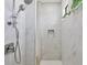 Clean walk-in shower with marble tile and chrome fixtures at 15625 Melport Cir, Port Charlotte, FL 33981