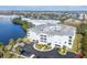 Aerial view of a waterfront condo building with parking and tropical landscaping at 2001 Bal Harbor Blvd # 2203, Punta Gorda, FL 33950