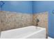 Bathroom with tub and tile surround at 2001 Bal Harbor Blvd # 2203, Punta Gorda, FL 33950