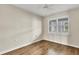 Bright bedroom with wood floors and window shutters at 2001 Bal Harbor Blvd # 2203, Punta Gorda, FL 33950
