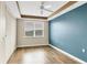 Bedroom with wood floors, ceiling fan and window at 2001 Bal Harbor Blvd # 2203, Punta Gorda, FL 33950