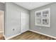 Simple bedroom with wood floors and window at 2001 Bal Harbor Blvd # 2203, Punta Gorda, FL 33950