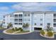 Three-story building with parking and landscaping at 2001 Bal Harbor Blvd # 2203, Punta Gorda, FL 33950