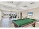 Community room with pool table and seating at 2001 Bal Harbor Blvd # 2203, Punta Gorda, FL 33950