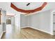 Spacious dining area with hardwood floors and a modern light fixture at 2001 Bal Harbor Blvd # 2203, Punta Gorda, FL 33950