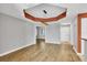Open dining area with hardwood floors and an accent wall at 2001 Bal Harbor Blvd # 2203, Punta Gorda, FL 33950