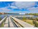 Wooden fishing pier extending over calm waters at 2001 Bal Harbor Blvd # 2203, Punta Gorda, FL 33950