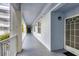 Clean and bright hallway with light blue walls and white railings at 2001 Bal Harbor Blvd # 2203, Punta Gorda, FL 33950