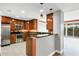 Modern kitchen with stainless steel appliances and wood cabinets at 2001 Bal Harbor Blvd # 2203, Punta Gorda, FL 33950