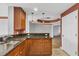 Kitchen features granite countertops and wood cabinets at 2001 Bal Harbor Blvd # 2203, Punta Gorda, FL 33950