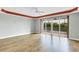 Spacious living room with wood floors and access to a balcony at 2001 Bal Harbor Blvd # 2203, Punta Gorda, FL 33950