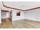 Open living room with wood floors and kitchen bar at 2001 Bal Harbor Blvd # 2203, Punta Gorda, FL 33950