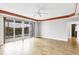 Living area with wood floors and sliding glass doors to balcony at 2001 Bal Harbor Blvd # 2203, Punta Gorda, FL 33950