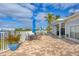 Community patio with tables, chairs, and umbrellas at 2001 Bal Harbor Blvd # 2203, Punta Gorda, FL 33950