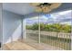 Bright screened balcony with ceiling fan and view of nature at 2001 Bal Harbor Blvd # 2203, Punta Gorda, FL 33950