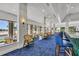 Modern bar with blue chairs and large windows, overlooking scenic views at 26812 Pavin Dr, Englewood, FL 34223