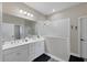 Double vanity bathroom with a large walk-in shower at 26812 Pavin Dr, Englewood, FL 34223