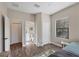 Bright bedroom with ensuite bathroom access and neutral decor at 26812 Pavin Dr, Englewood, FL 34223