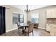 Cozy breakfast nook features a round table and chairs near kitchen at 26812 Pavin Dr, Englewood, FL 34223