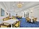 Well-appointed clubhouse room with tables and chairs at 26812 Pavin Dr, Englewood, FL 34223
