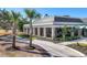 Community clubhouse with a beautiful exterior and landscaping at 26812 Pavin Dr, Englewood, FL 34223