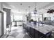 Modern kitchen with large island and stainless steel appliances at 26812 Pavin Dr, Englewood, FL 34223